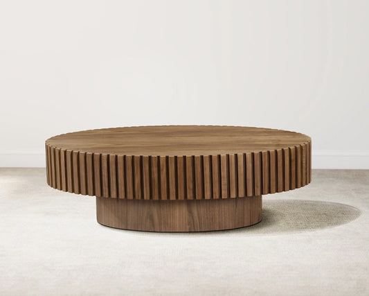 Wooden coffee table with a ribbed design on a plain background