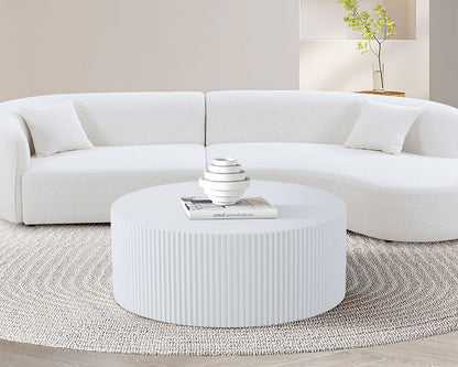 Sleek and Modern Round Coffee Table with Eye-Catching Relief Design